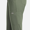 A pair of women's full elastic pull-on pants in olive green, featuring a side pocket and a logo.