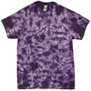 A crinkle tie dye T-shirt in shades of purple, featuring a vibrant, textured pattern and a label on the neckline.