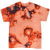 An orange and black tie-dye T-shirt with a vibrant pattern and a loose fit. The shirt features a logo.