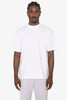A white short sleeve crewneck tee, featuring a relaxed fit and a logo on the front. The model wears grey shorts.