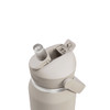 A drink bottle in a light beige colour featuring a flip straw and a secure cap, with a logo on the body.