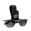 A black visor glasses holder with a clip and silver sunglasses featured in front. Includes a logo design.