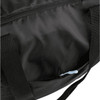 A packable travel duffel bag in black, featuring a zippered pocket and sturdy handles. It has a logo.