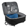 A black travel backpack with grey lining, featuring compartments for a blue pillow and various travel essentials.
