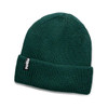 A green knitted beanie with a folded cuff and a logo tag.