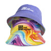 A custom reversible bucket hat featuring a purple terry side and a multicoloured swirling pattern on the twill side.
