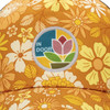 A trucker cap in a yellow floral pattern featuring a circular patch with a colourful design.