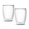 Two clear glass tumblers featuring a double wall design, offering an elegant and modern look.