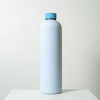 A drink bottle in a light blue colour with a blue cap. The bottle features a logo on its surface.