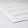 A white magnetic whiteboard with black outline sections for notes, featuring a logo in the corner.