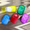 A collection of small, colourful containers in yellow, green, red, blue, and purple, featuring various logos and branding.