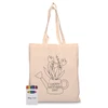 A beige calico tote bag featuring a watering can design with flowers. Includes a pack of colourful crayons.