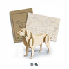 A wooden dog model in a light natural colour, accompanied by assembly instructions on a tan background with outlines.