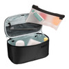 A black toiletry bag with a removable pouch, featuring a toothbrush, toothpaste, and travel-sized containers inside.