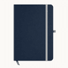 A navy blue A5 notebook with a grey elastic band and a ribbon bookmark. It features a logo on the cover.