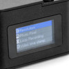 A small black camera featuring a display screen with menu options for settings like resolution and video timestamp.