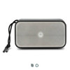 A rectangular grey and silver 10W bass speaker with a textured surface and a detachable strap. It features a logo.