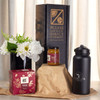 A festive essentials set featuring a black drink bottle, a candle jar, a gift box, and a flower arrangement.