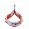 A red and white silicone stress reliever keychain with multiple poppable sections and a metal keyring.
