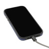 A black smartphone with a textured case and a grey charging cable connected.