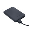 A black power bank with charging cable attached, featuring USB ports and indicator lights.