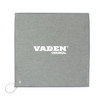 A grey golf towel with a loop for attachment, featuring a logo in the centre.