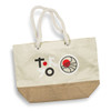 A cream tote bag with a jute bottom, featuring a logo and colourful graphics. It has sturdy rope handles.