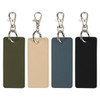 A set of four rectangular keychains in green, beige, blue, and black, each with a silver clip and ring.
