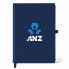 A navy A5 smart notebook with a logo on the cover and a matching ribbon bookmark.