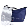A navy cooler bag with a logo, accompanied by a grey and white towel, both neatly arranged.