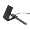 A black foldable 3-in-1 magnetic wireless charger with a spot for a phone, AirPods, and an Apple Watch.