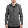 A black and white checkered patterned shirt with a single pocket and long sleeves. It features a logo.