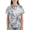 A short-sleeved golf polo in a grey and black tie-dye pattern, featuring a collar and a subtle logo.