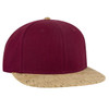 A maroon mid-profile snapback cap with a cork peak and a small logo on the side.