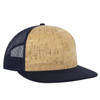 A mid-profile trucker cap features a cork front and navy mesh back, with a navy peak and logo.