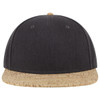 A black snapback cap with a cork peak and a subtle logo on the front.