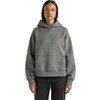 A grey active hooded sweatshirt with a front pocket and a relaxed fit, displayed on a model.