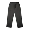 Faded cuffless track pants in dark grey with an elastic waistband and a back pocket. Features a logo branding.