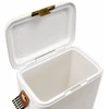 A white cooler with a gold latch and a side handle, featuring an open lid showing the empty interior.