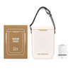 A cooler bag in off-white with a strap, next to a brown box featuring branding and an informational sheet.