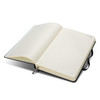 A black Moleskine 2027 Planner, featuring blank, lined pages and an elastic closure.