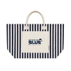 A striped navy and cream tote bag featuring a front pocket and handles, with a logo on the pocket.