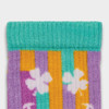 Multicoloured knitted socks featuring purple, orange, and turquoise stripes with white floral designs. Includes a logo.