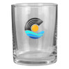 A clear rocks glass featuring a circular logo with waves and a sun design in blue and yellow.