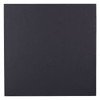 A black, square promotional product box with a smooth surface and a subtle texture, featuring a logo.