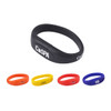 An oval silicone wristband flash drive in black, with orange, yellow, and blue wristband options, featuring logos.