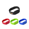 A set of silicone watch flash drives in black, red, green, and blue, featuring a logo on the black drive.