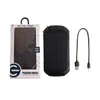 A black and green outdoor solar wireless power bank with a USB cable and packaging. It features a logo on the box.