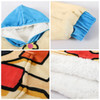 A wearable blanket featuring a blue hood and sleeves, with a soft, plush interior and a colourful design.