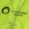 A bright yellow hi-vis vest with reflective tapes and functional pockets, featuring a company logo.
